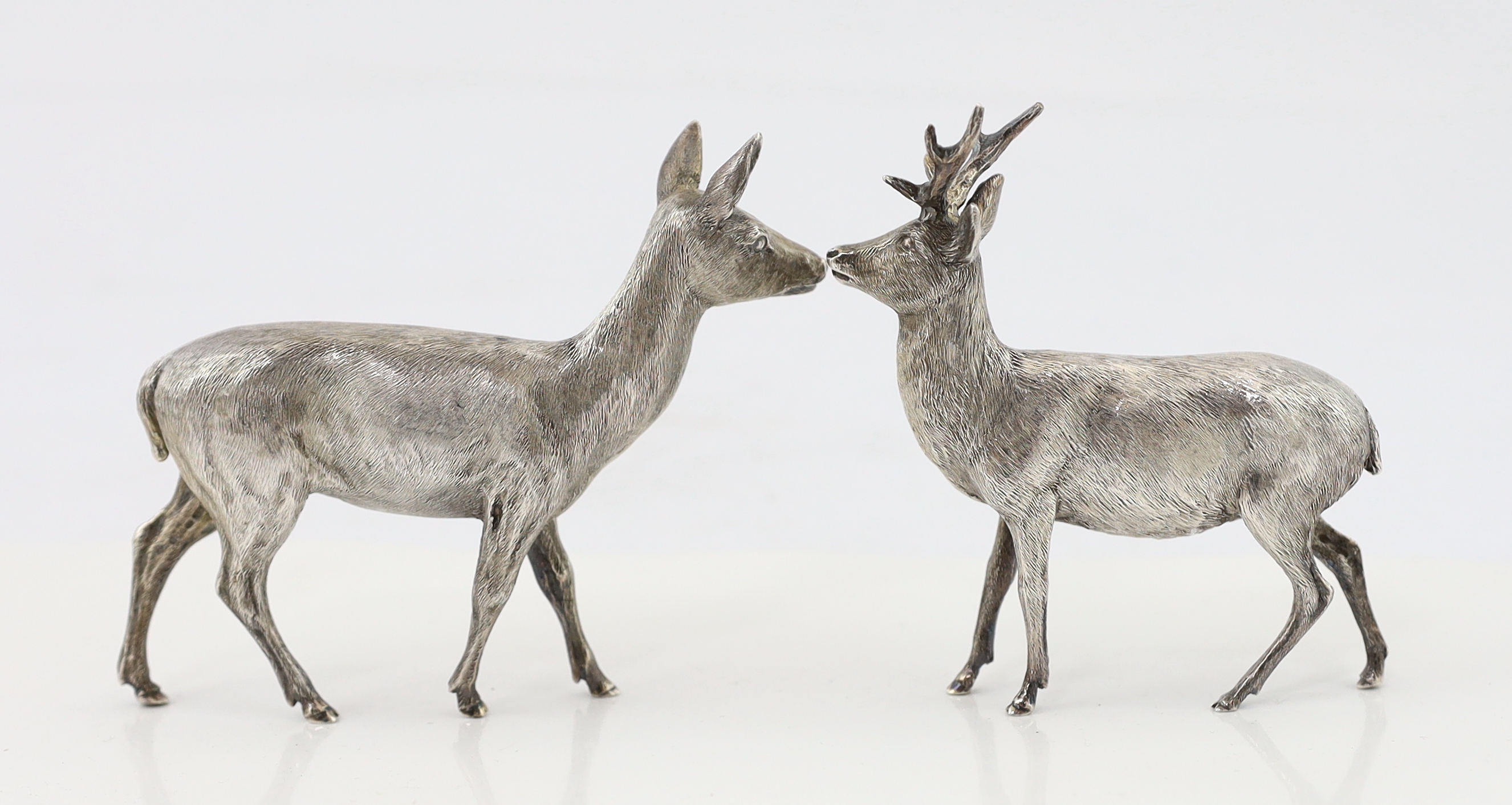 A pair of Elizabeth II Scottish silver free standing models of a stag and doe, by Hamilton & Inches